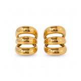 Pendientes ear cuff triples de Rouse Doree en metal dorado con diseño de aros apilados sin necesidad de perforación.